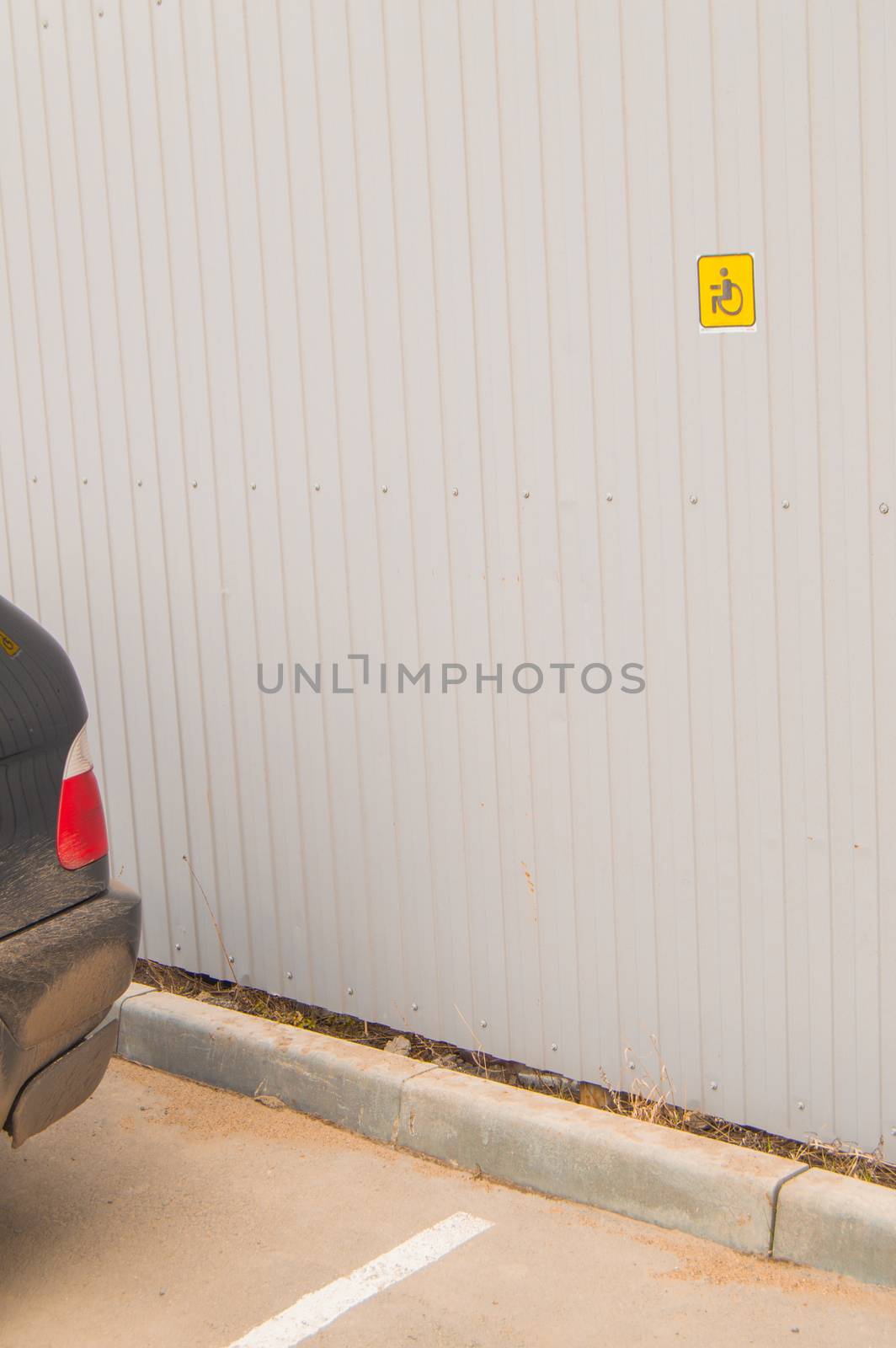 Reserved Parking sign for disabled small size on metal fence, accessible environment for people with disabilities by claire_lucia