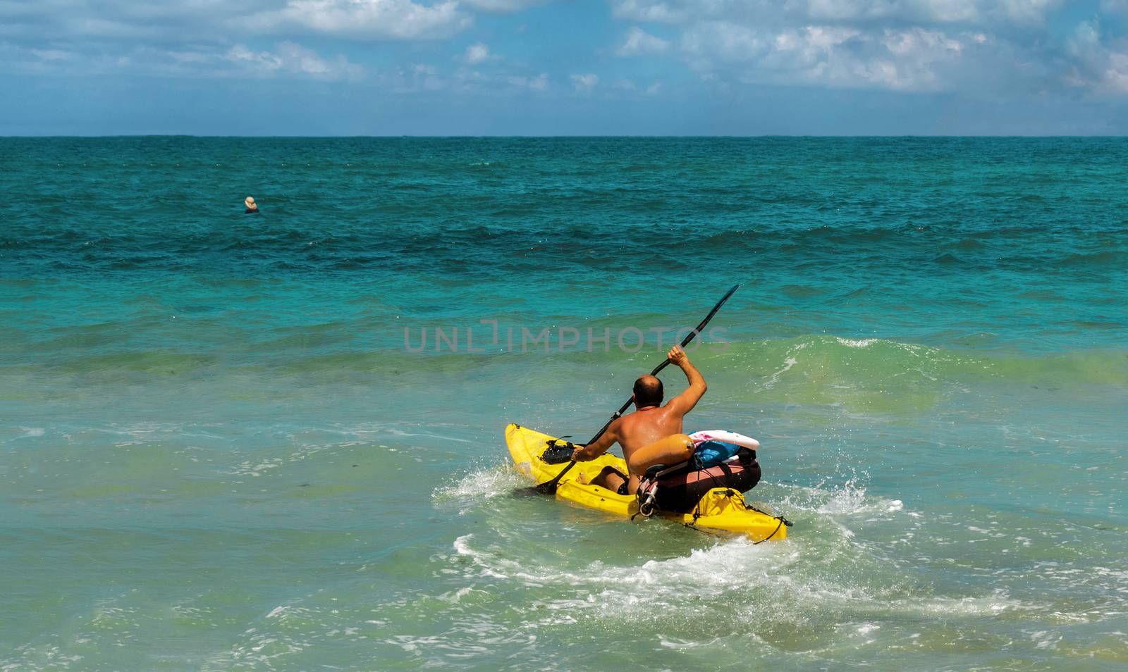 In the days of the swimming season at sea are lifeguard training on kayaks