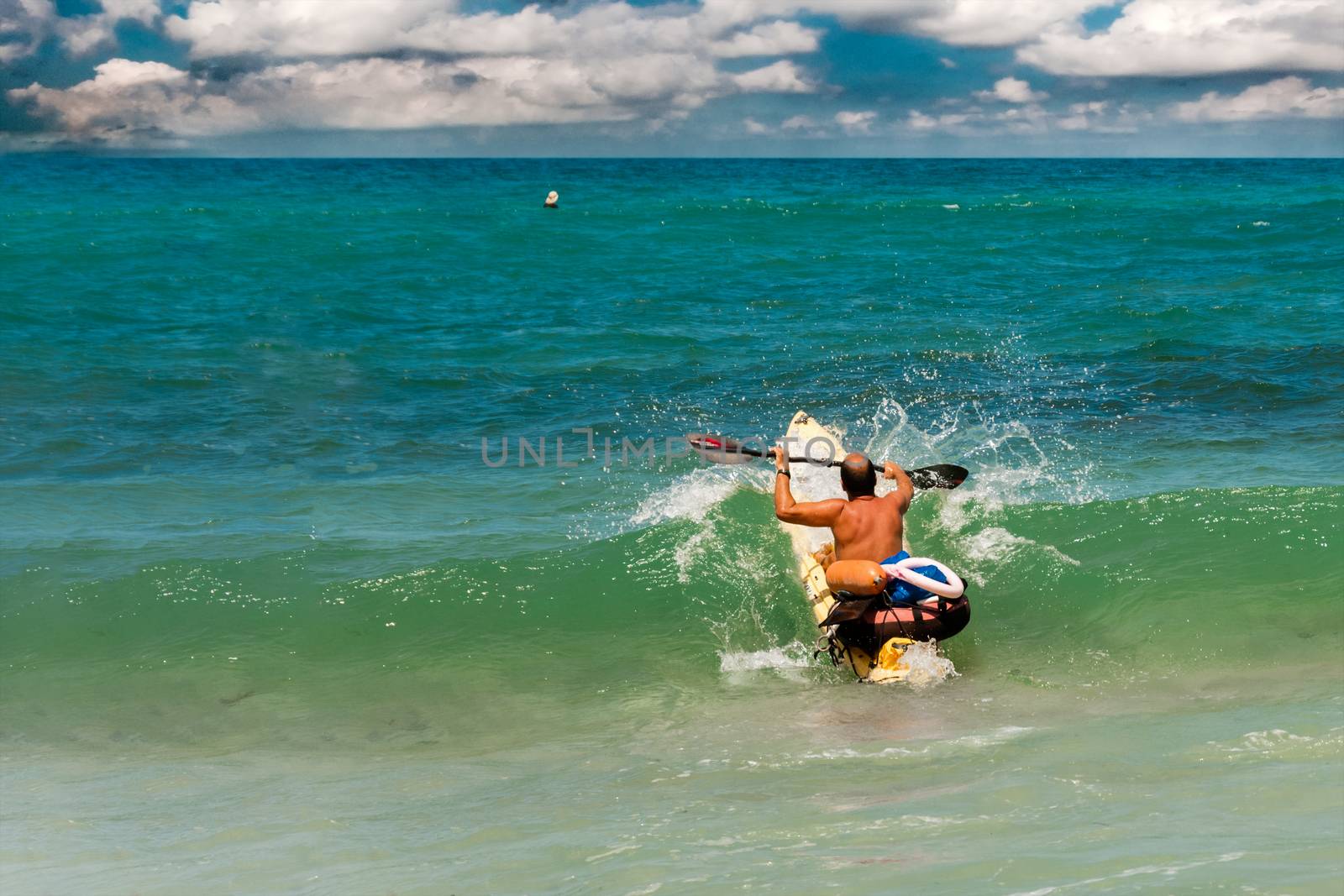 In the days of the swimming season at sea are lifeguard training on kayaks