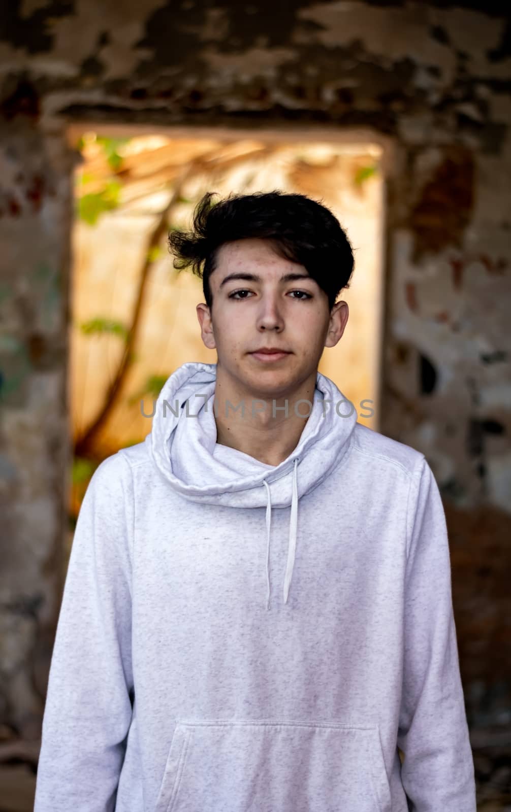 Young boy posing in abandoned house