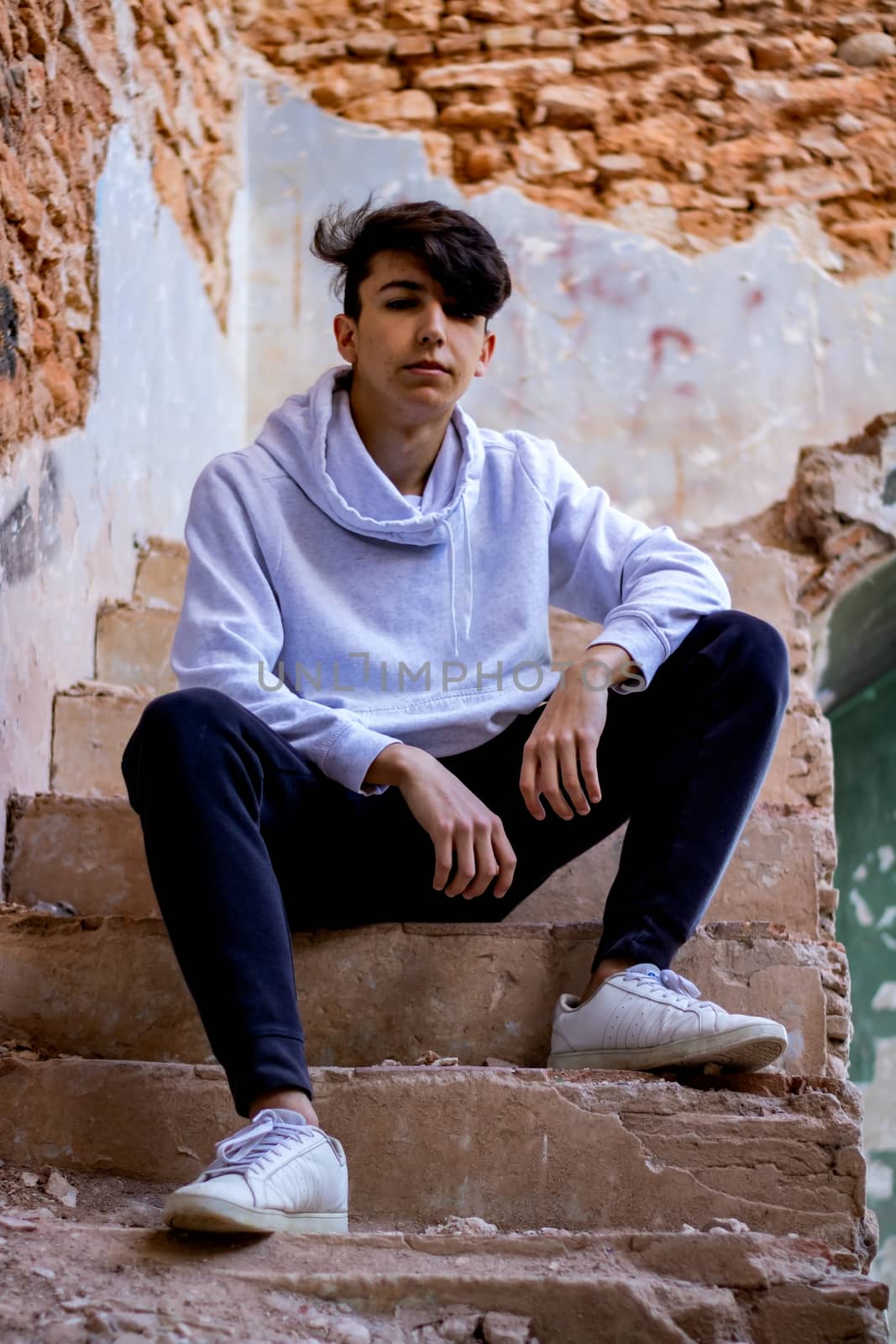 Young boy posing in abandoned house