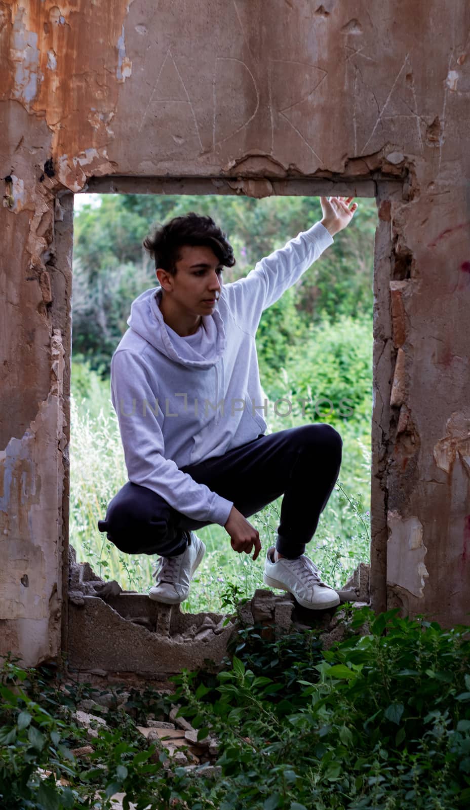 Young boy posing in abandoned house