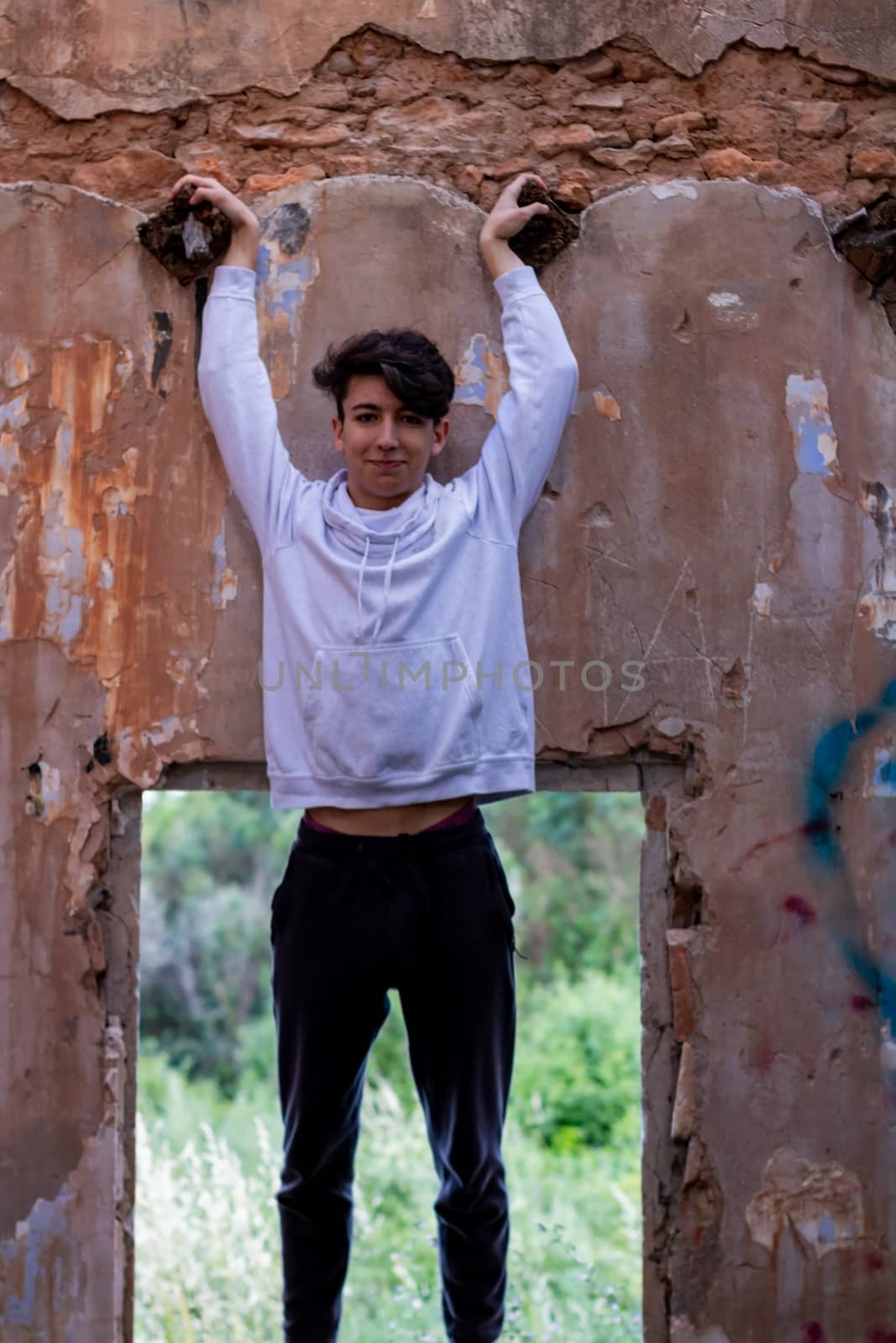 Young boy posing in abandoned house