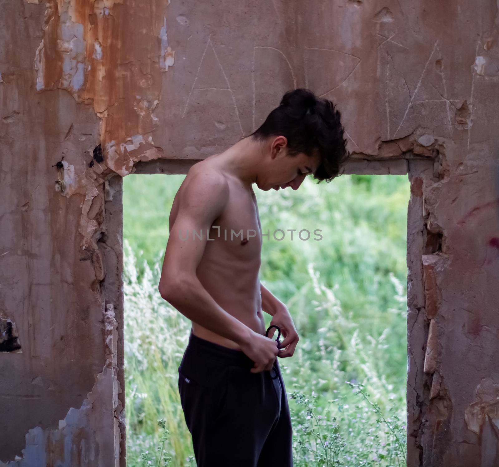 Young boy posing in abandoned house