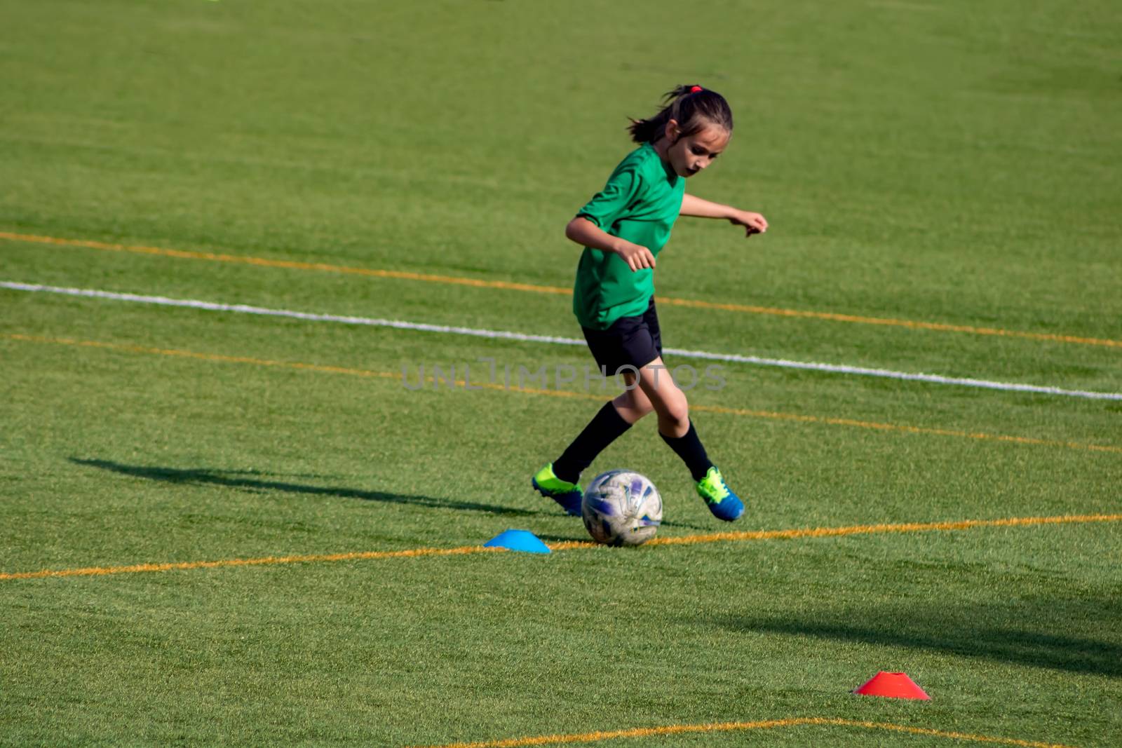 Little girl in a soccer training in Burriana