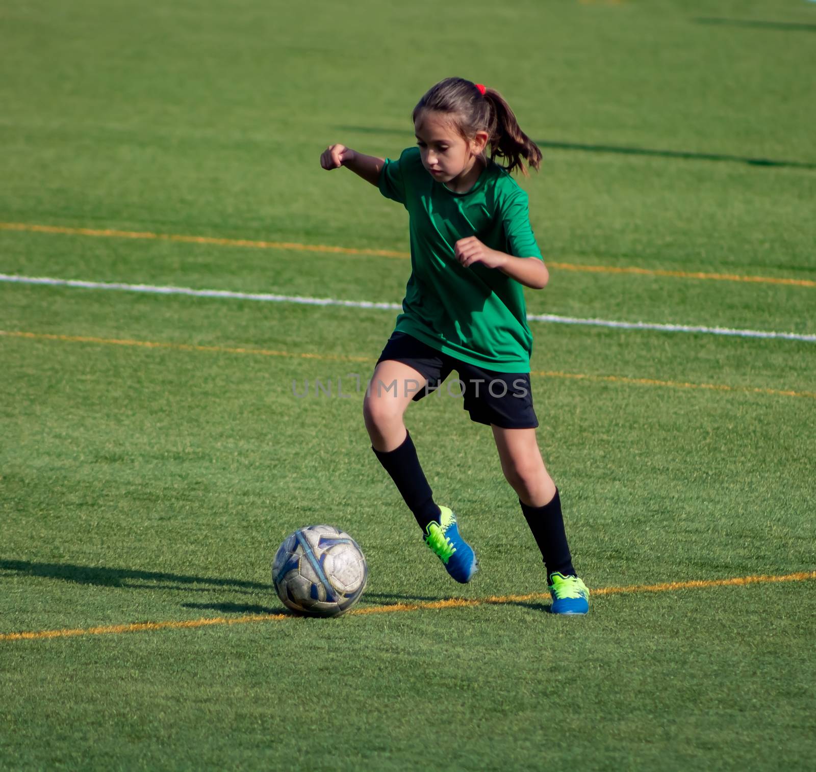 Little girl in a soccer training in Burriana