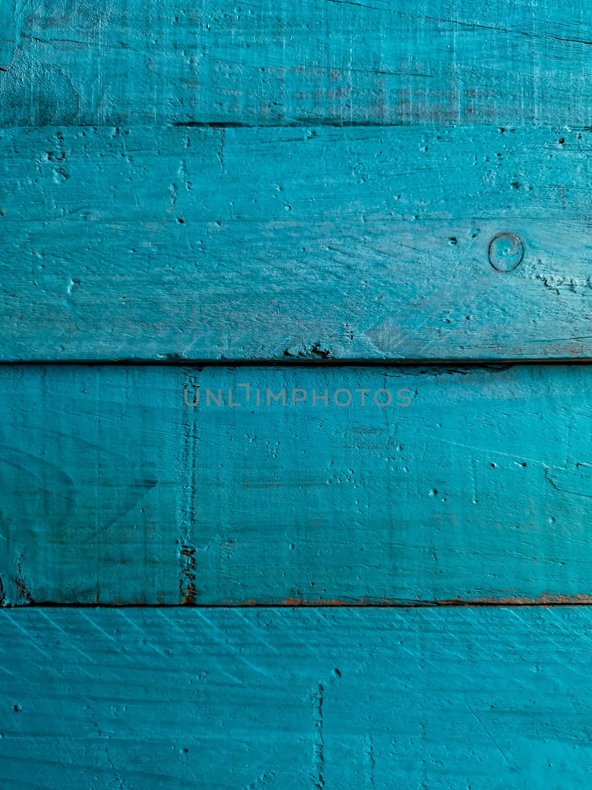 Old and worn wooden background painted blue