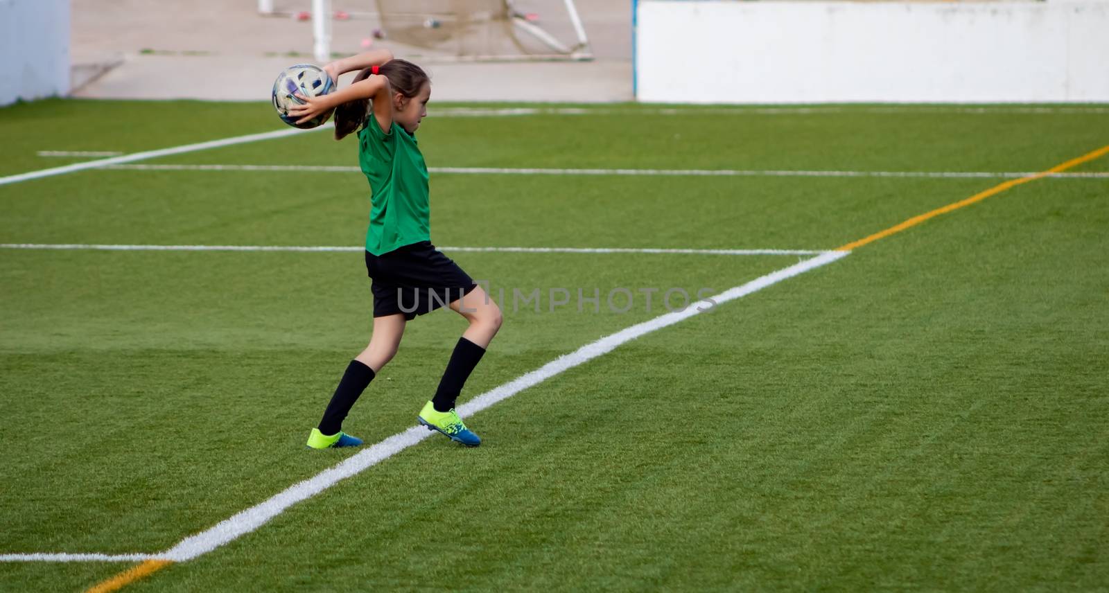 Little girl in a soccer training in Burriana