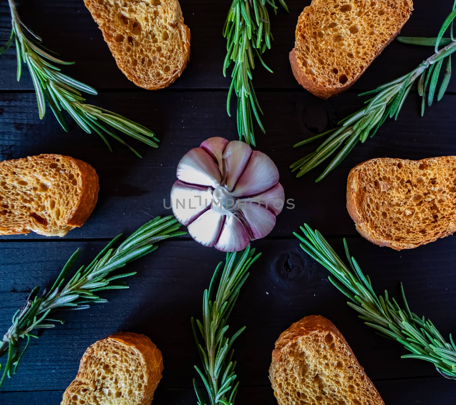 Ingredients for garlic soup in composition on wooden background