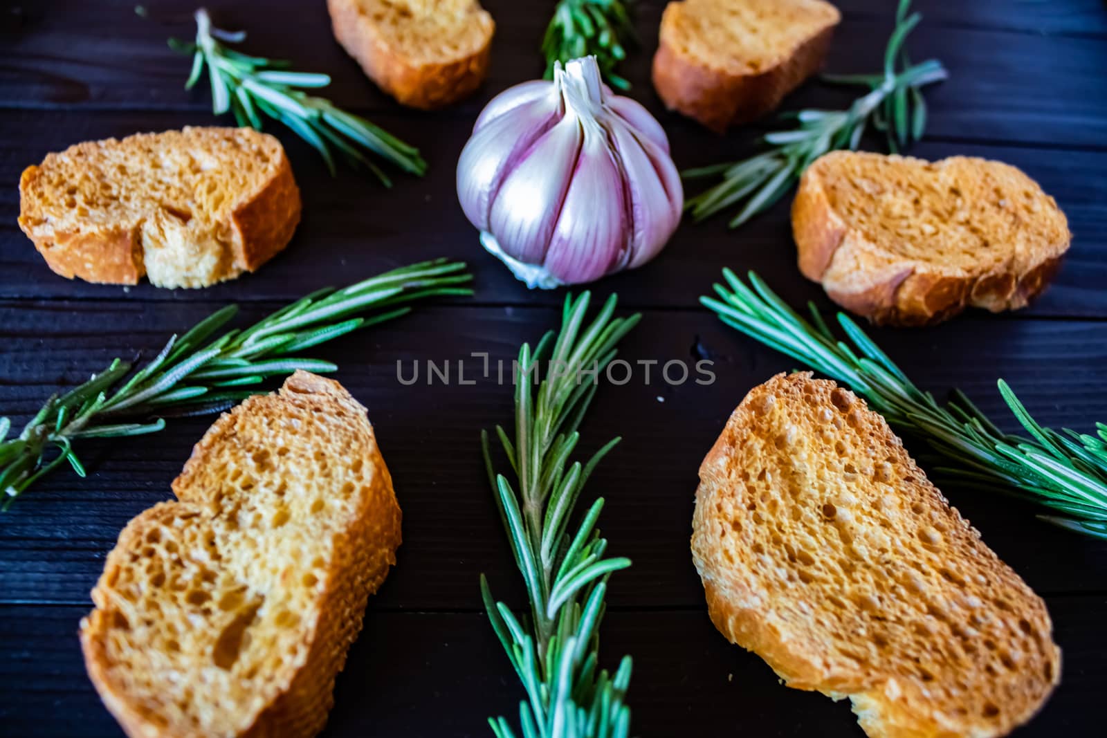 Ingredients for garlic soup in composition on wooden background