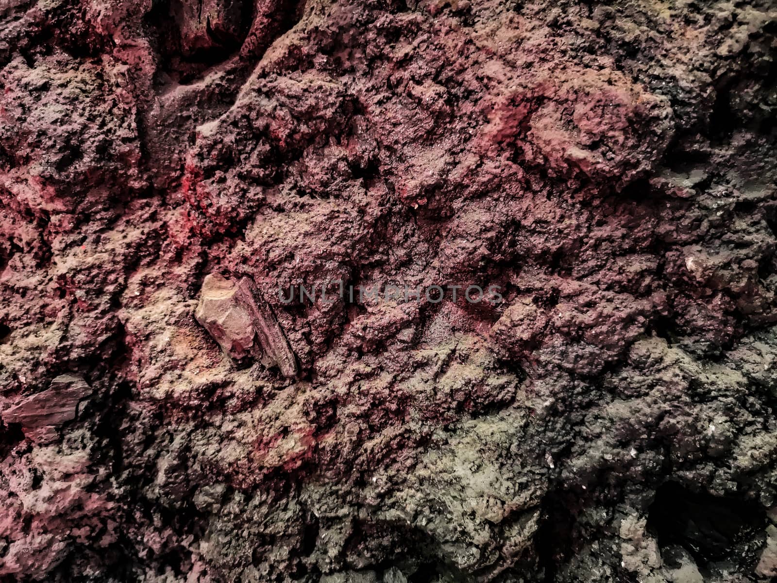 Natural rock background in brown and purple tones