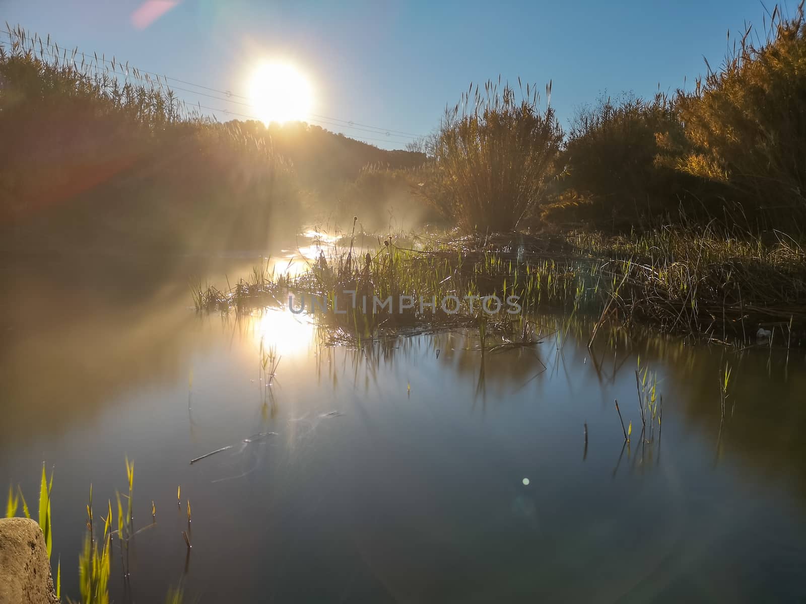 River with water evaporating on a very cold morning in the mountain