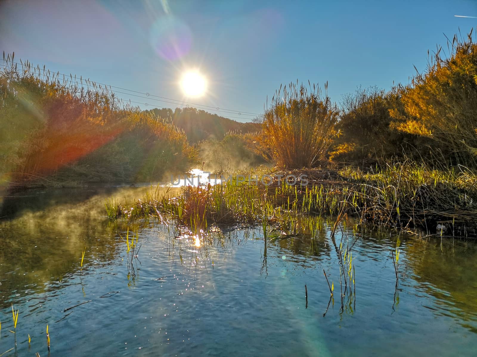 River with water evaporating on a very cold morning in the mountain