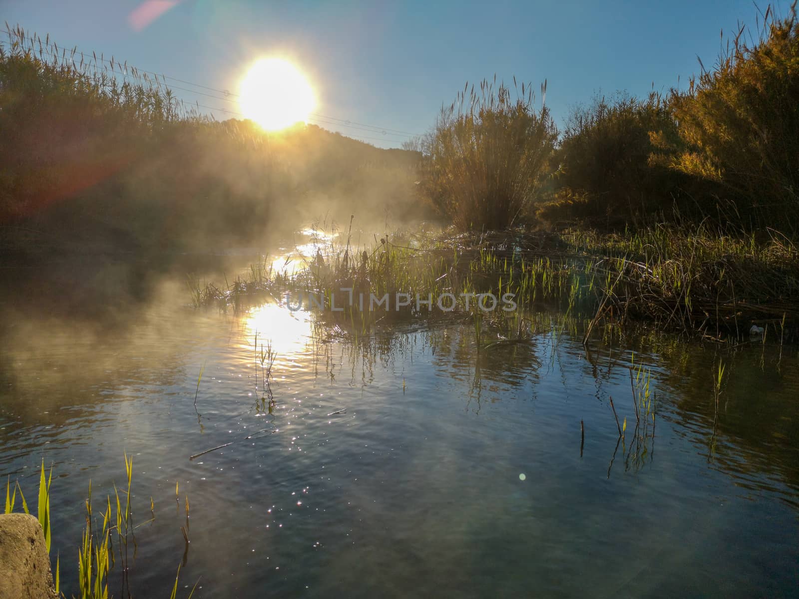 River with water evaporating on a very cold morning in the mountain