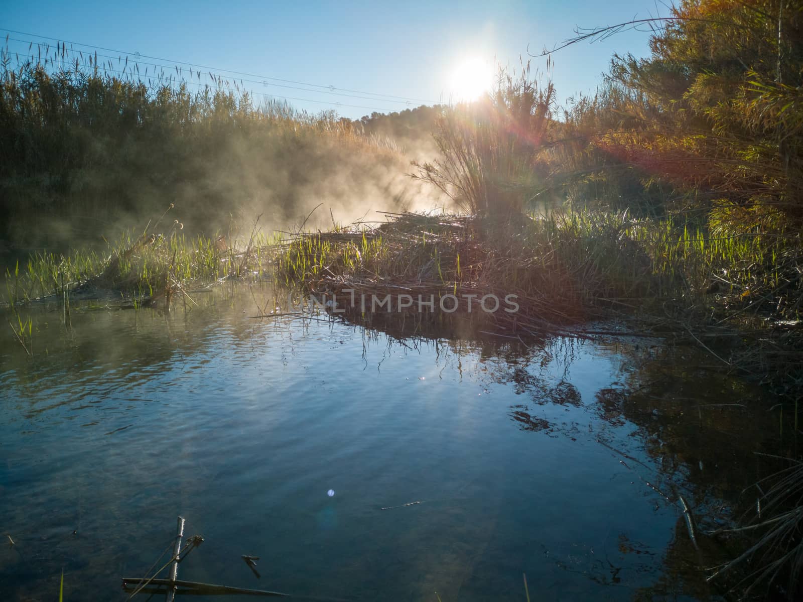 River with water evaporating on a very cold morning in the mountain