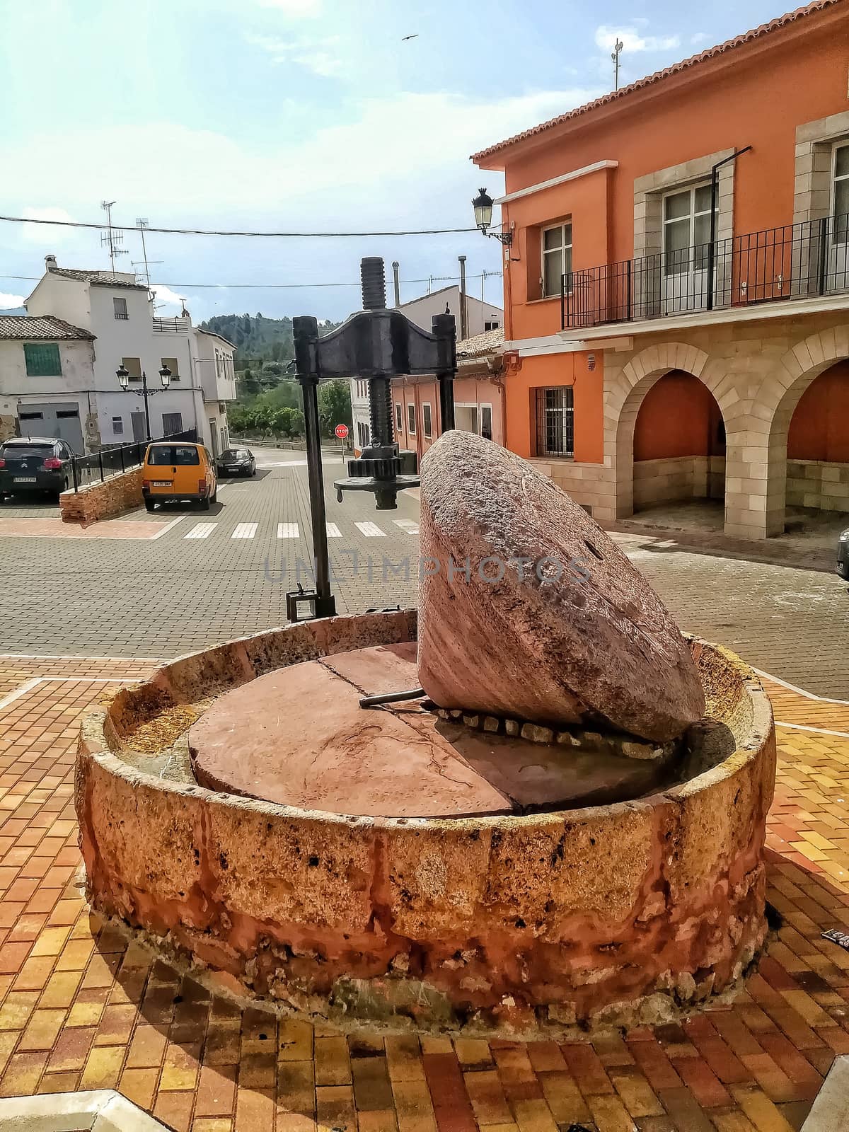 Ancient stone mill to make olive oil exposed in the town square