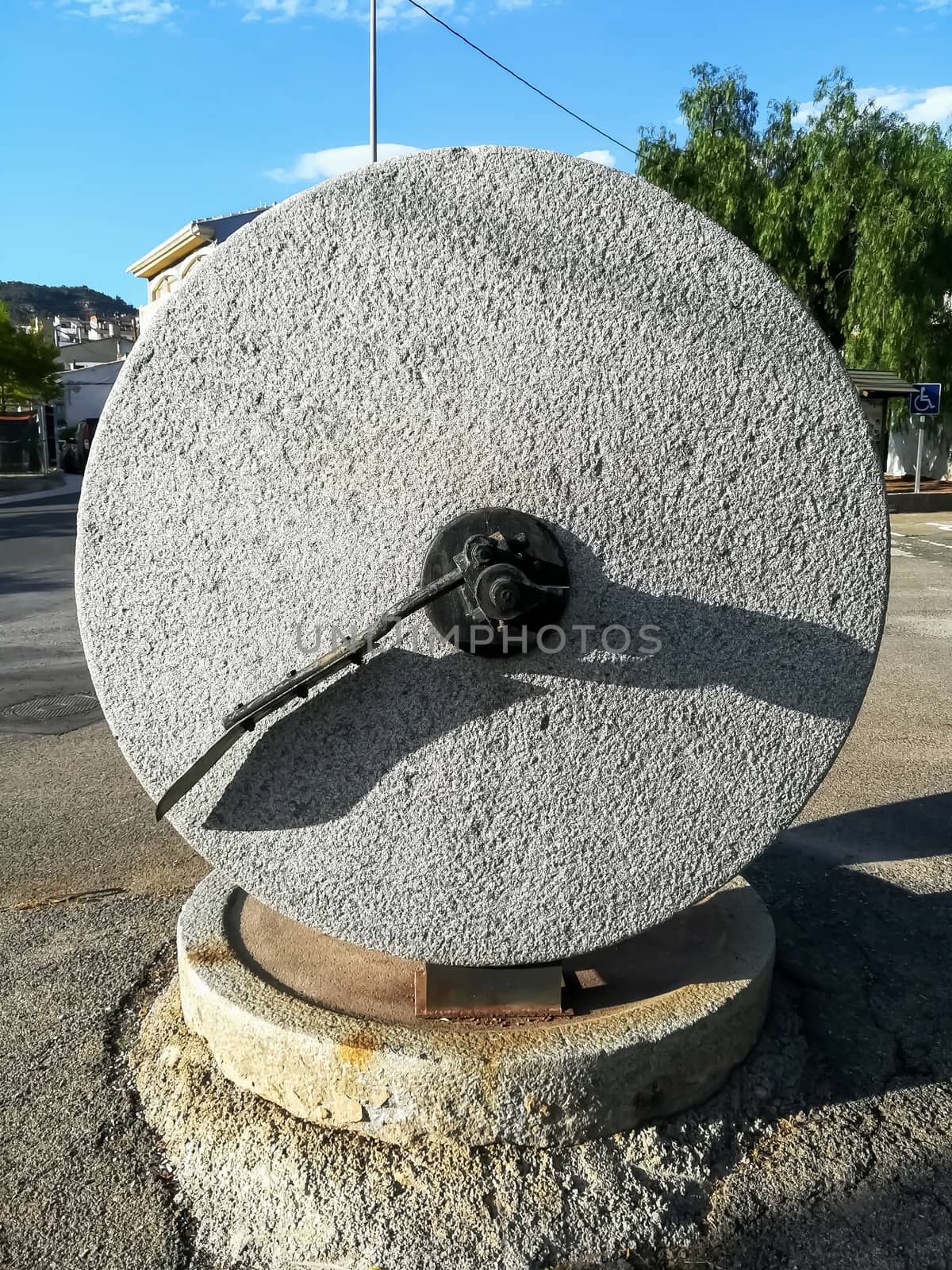 Ancient stone mill to make olive oil exposed in the town square