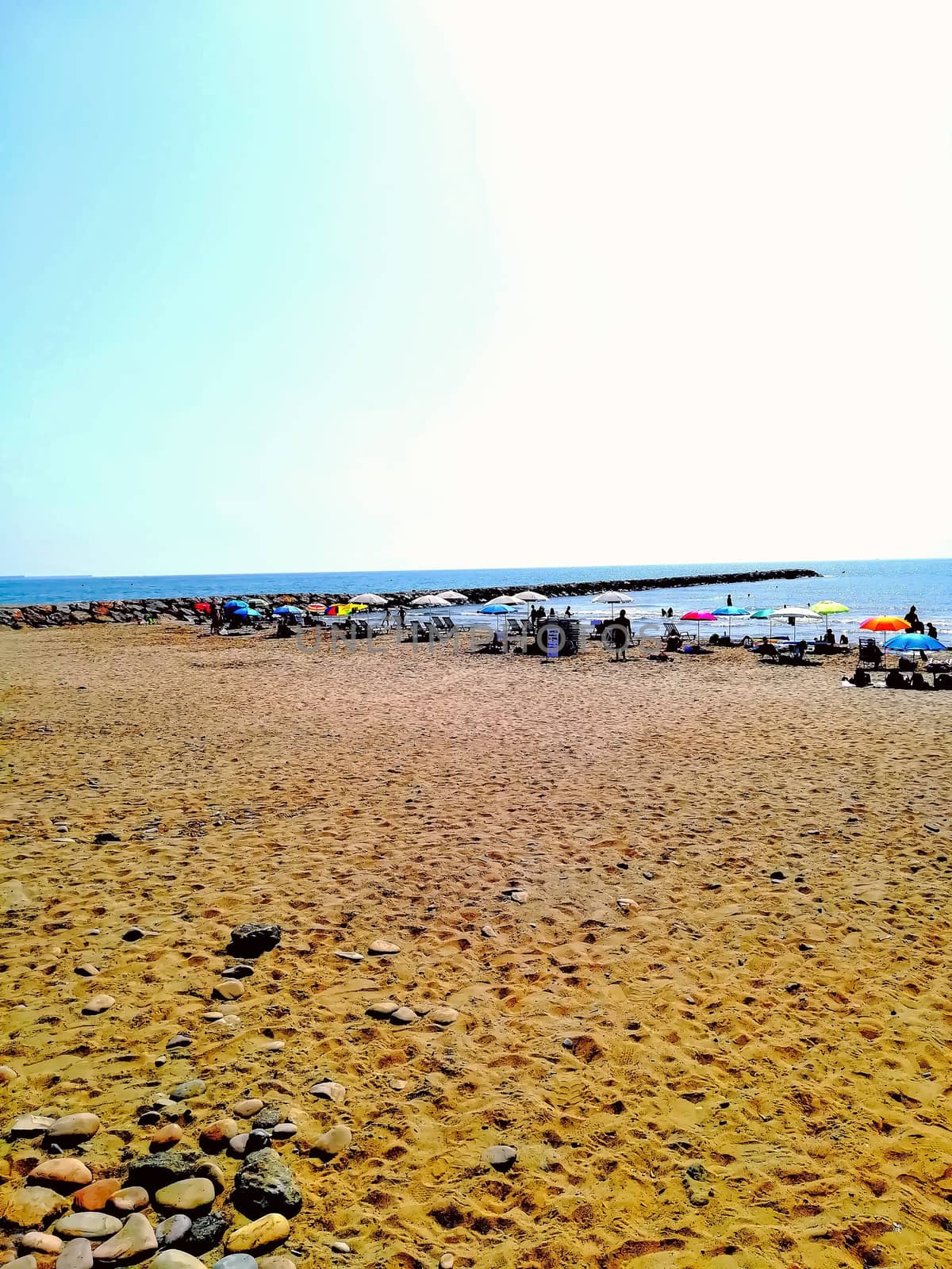 Beach of fine brown sand bathed by the waters of the Mediterranean Sea