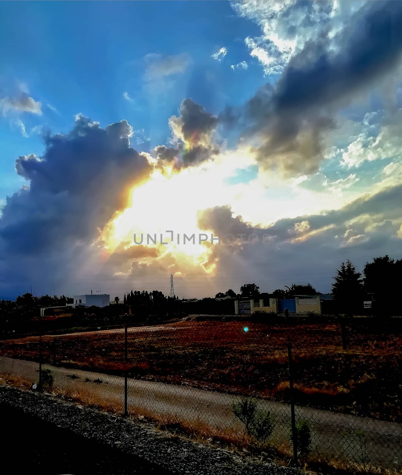 Sunset with threatening storm clouds over mountains