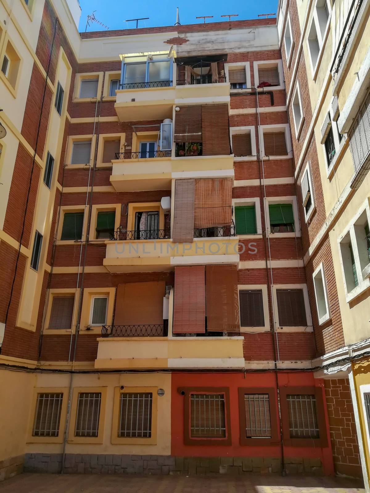 Brown building with roller blinds in Puzol