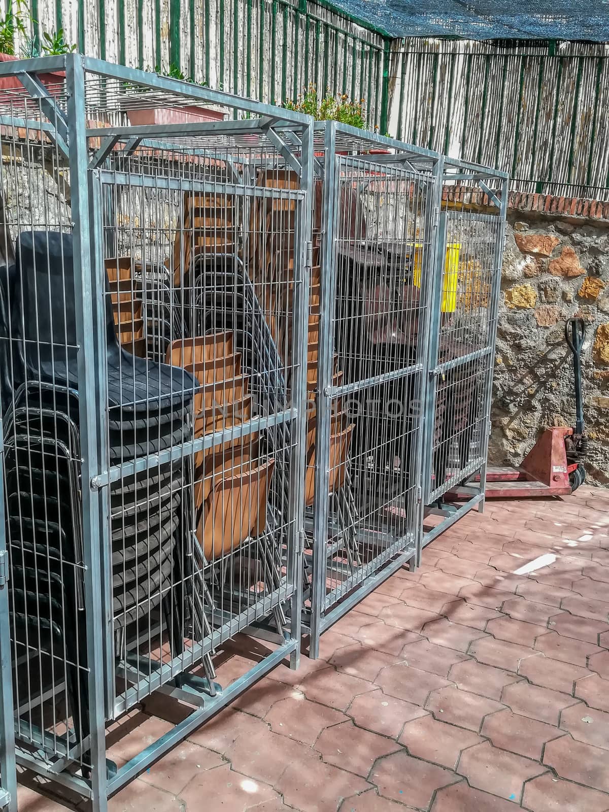 Cage to store outdoor chairs in the Pavias square for the patron saint