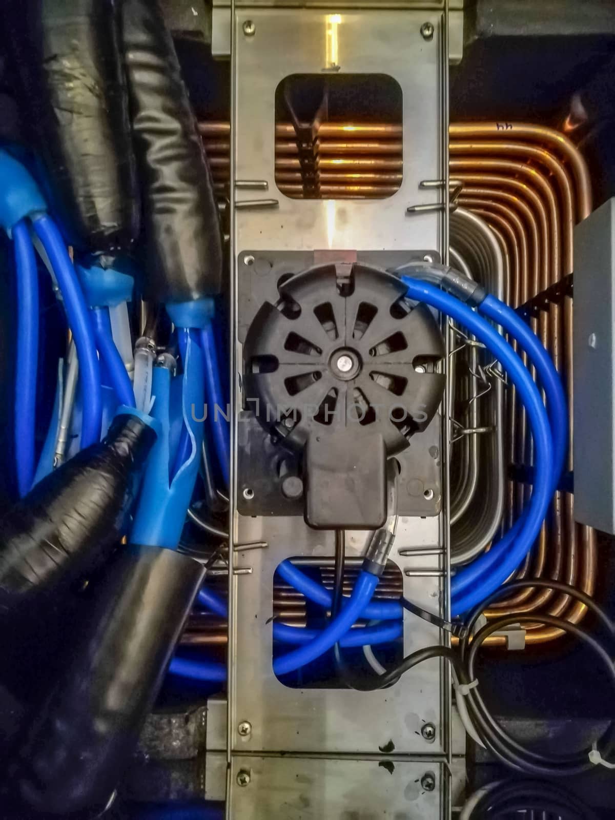 View of the interior of a beer machine with multiple pipelines connected