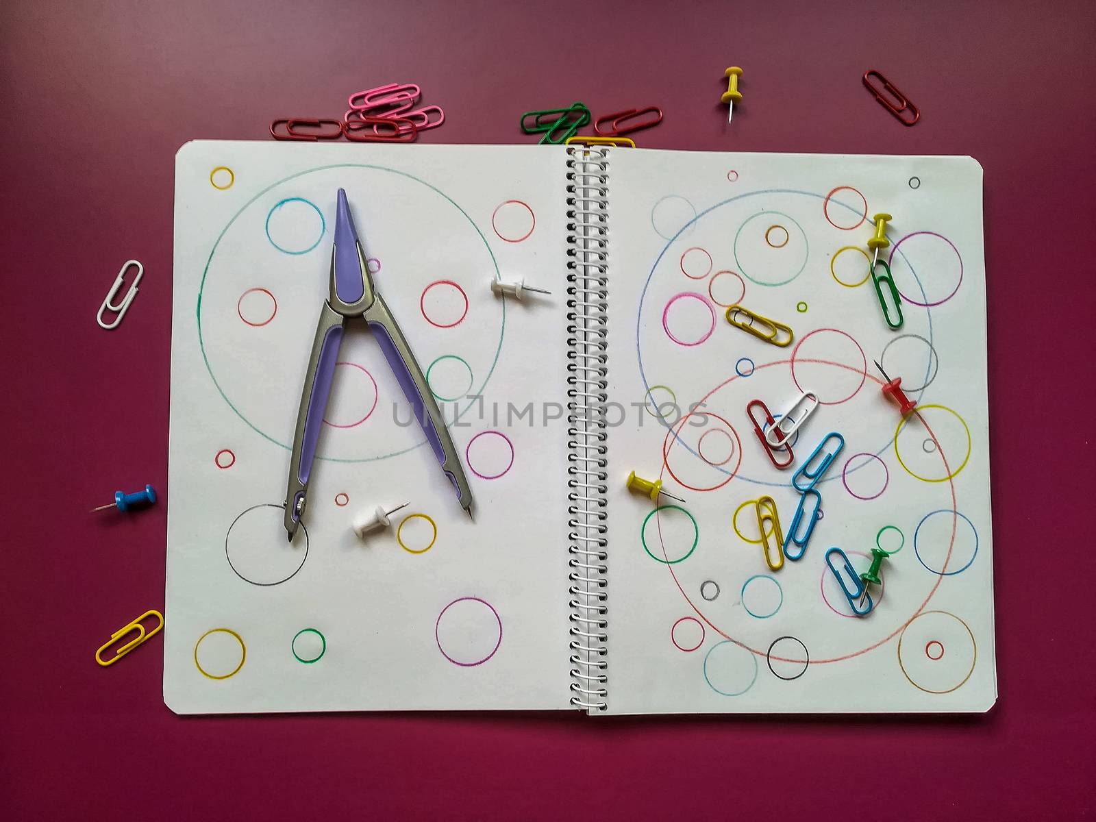 Various school material in composition on purple background