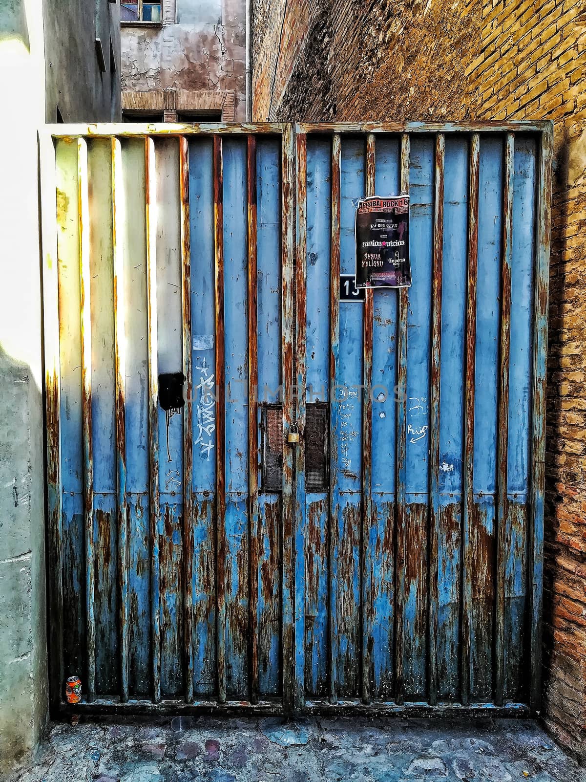 Blue door with rusty metal in a Segorbe alley