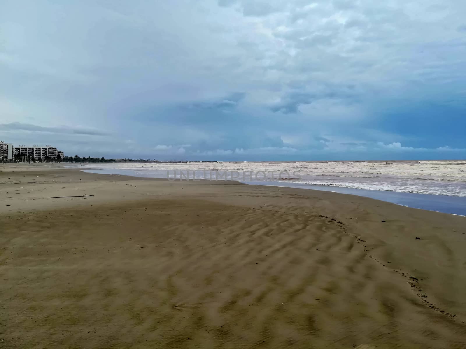 Beach of fine brown sand bathed by the waters of the Mediterranean Sea