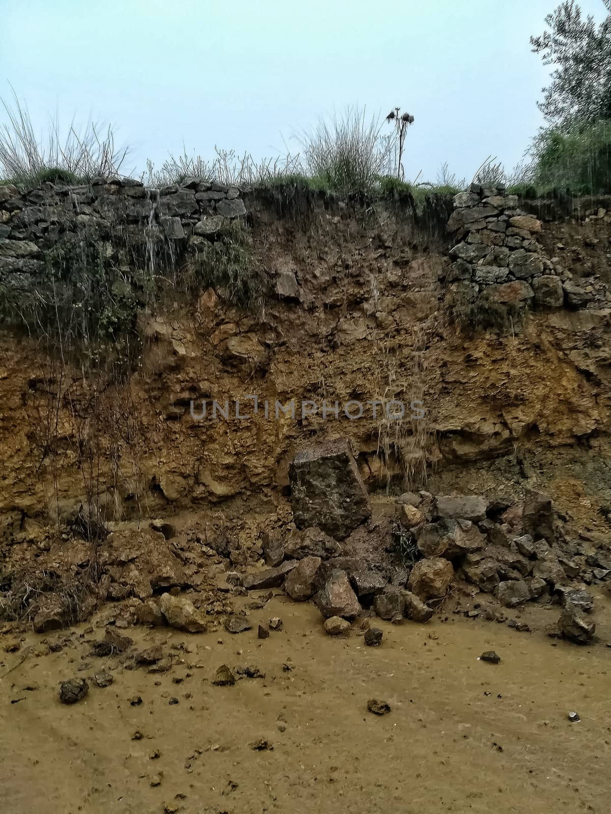 Detachment of rocks in a wall after heavy raiin