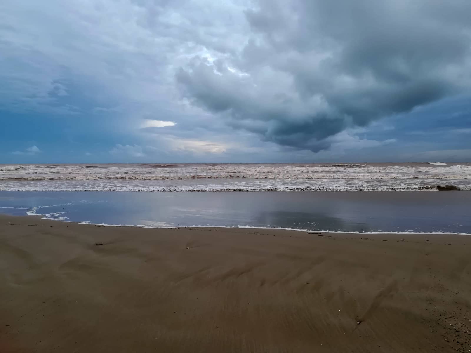 Beach of fine brown sand bathed by the waters of the Mediterranean Sea