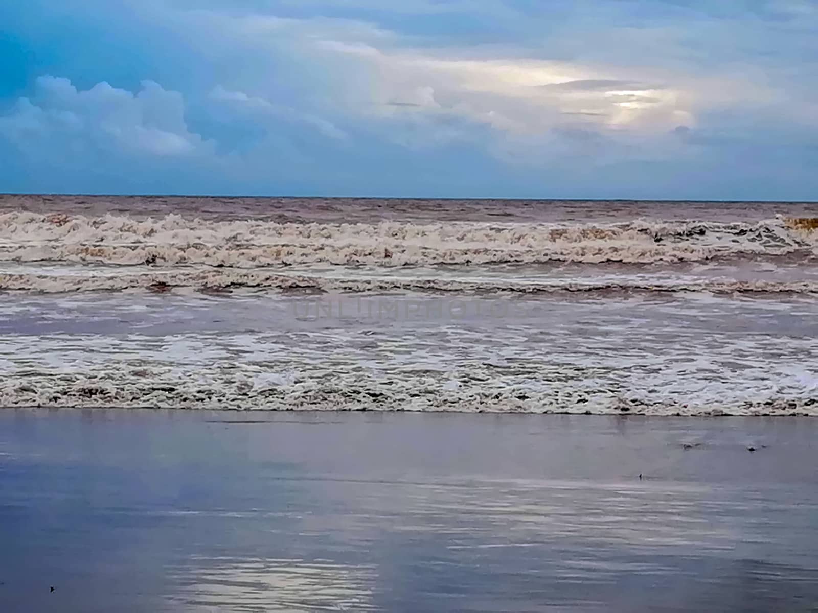Beach of fine brown sand bathed by the waters of the Mediterranean Sea