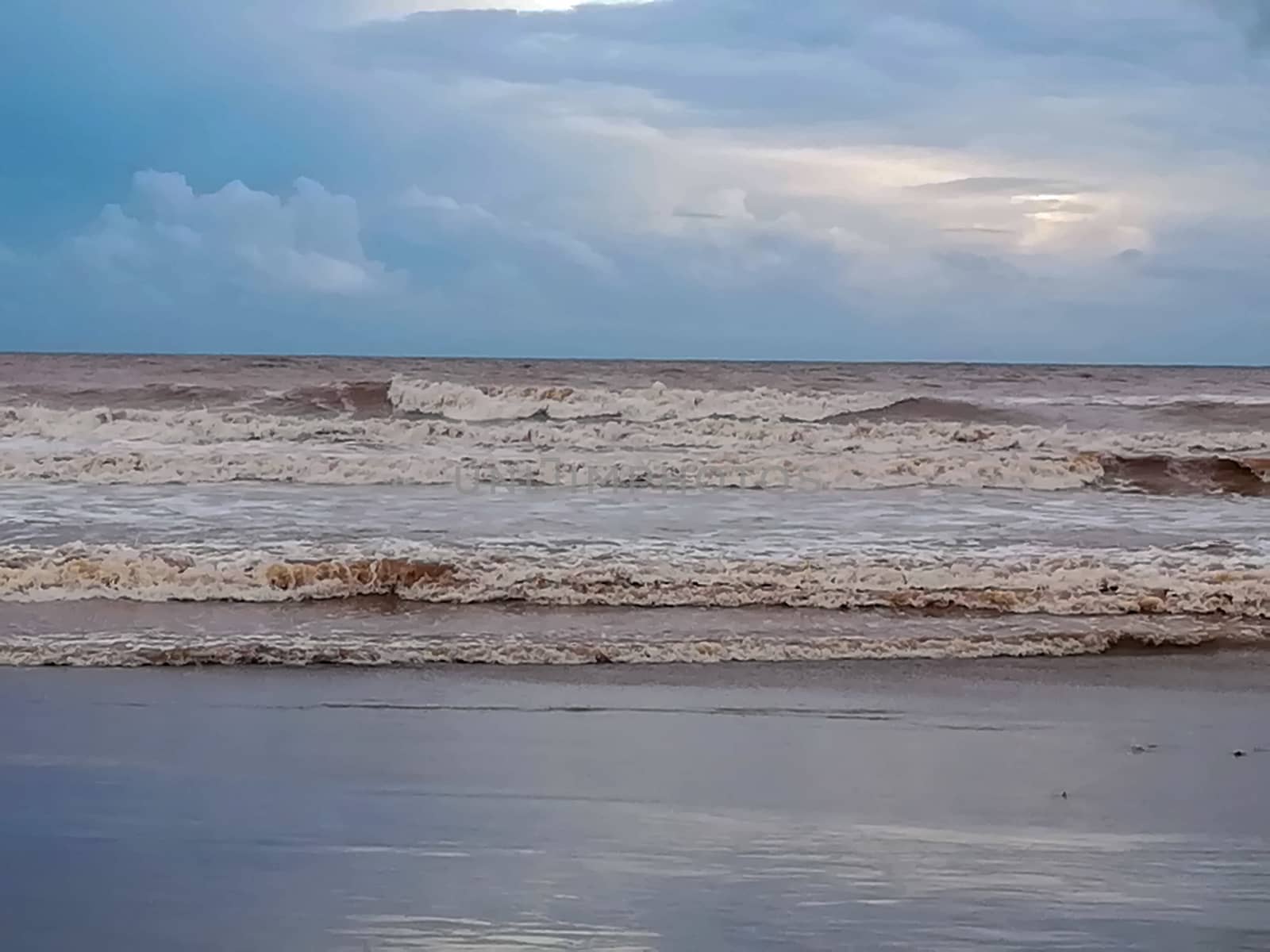 Beach of fine brown sand bathed by the waters of the Mediterranean Sea