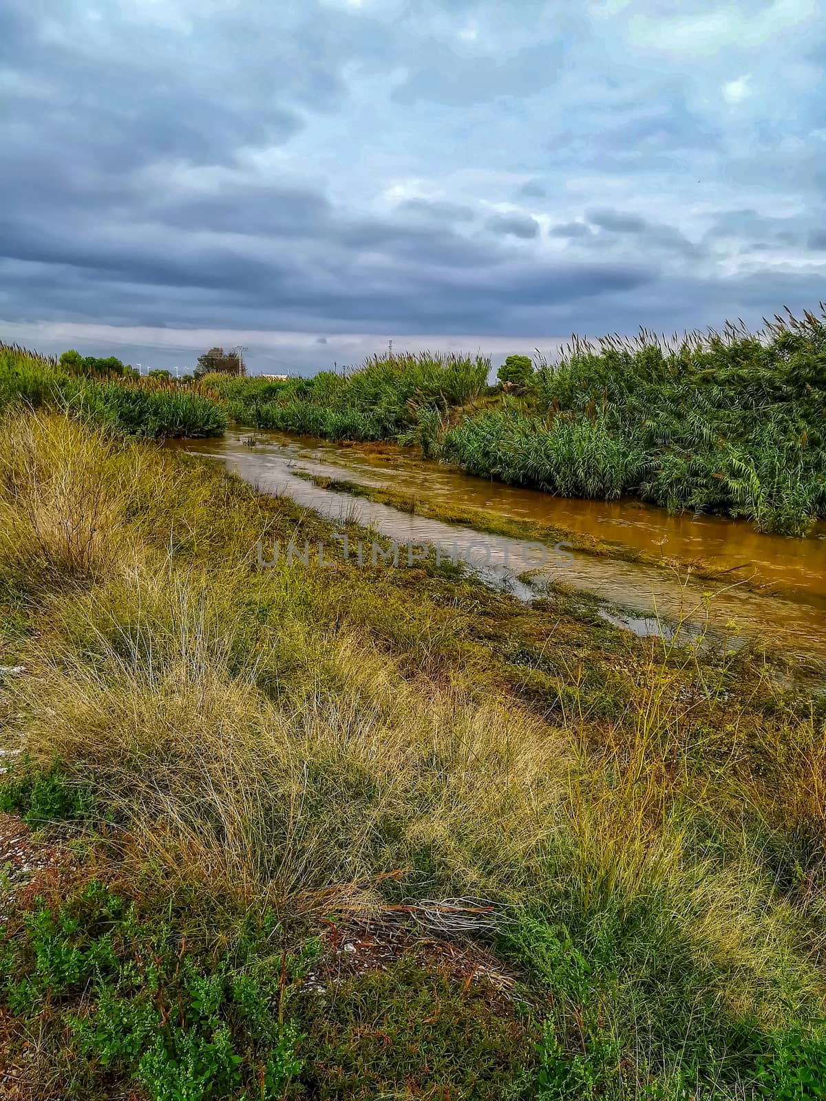 River of the natural setting of Clot with sediment laden water after heavy rains