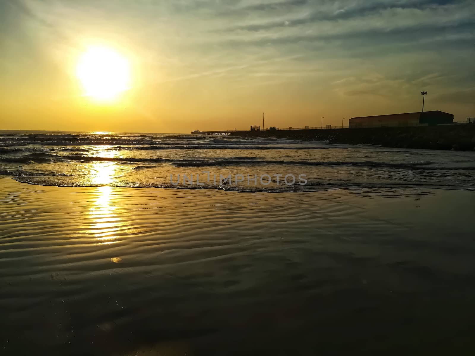 Beach of fine brown sand bathed by the waters of the Mediterranean Sea