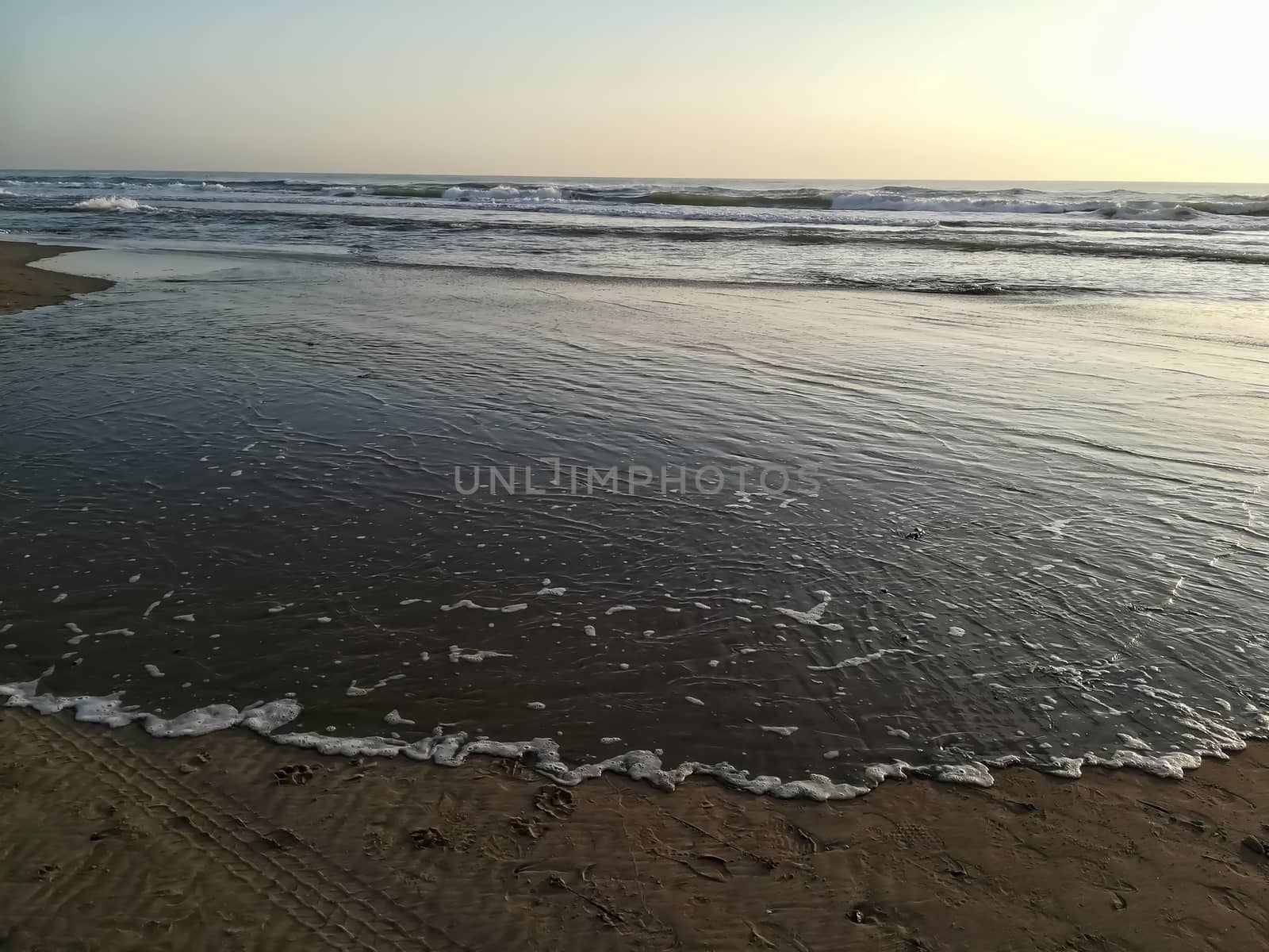 Beach of fine brown sand bathed by the waters of the Mediterranean Sea