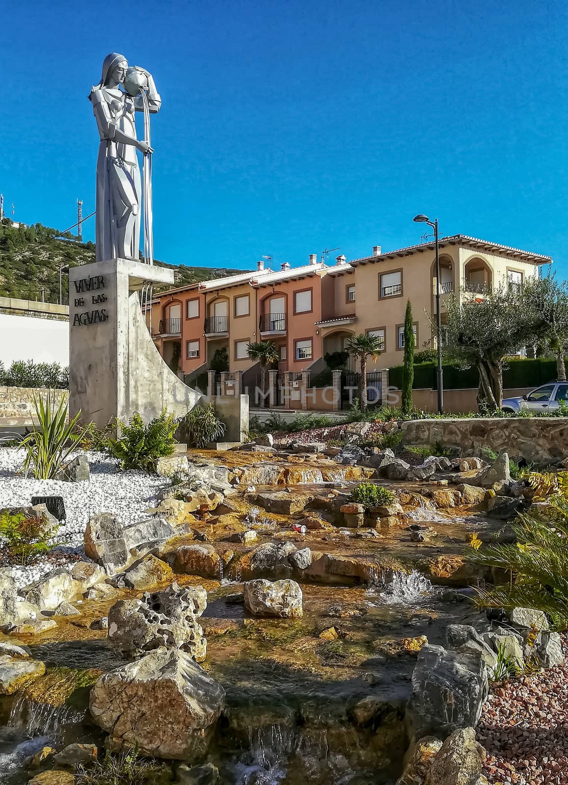 Statue of a woman pouring oil in Viver