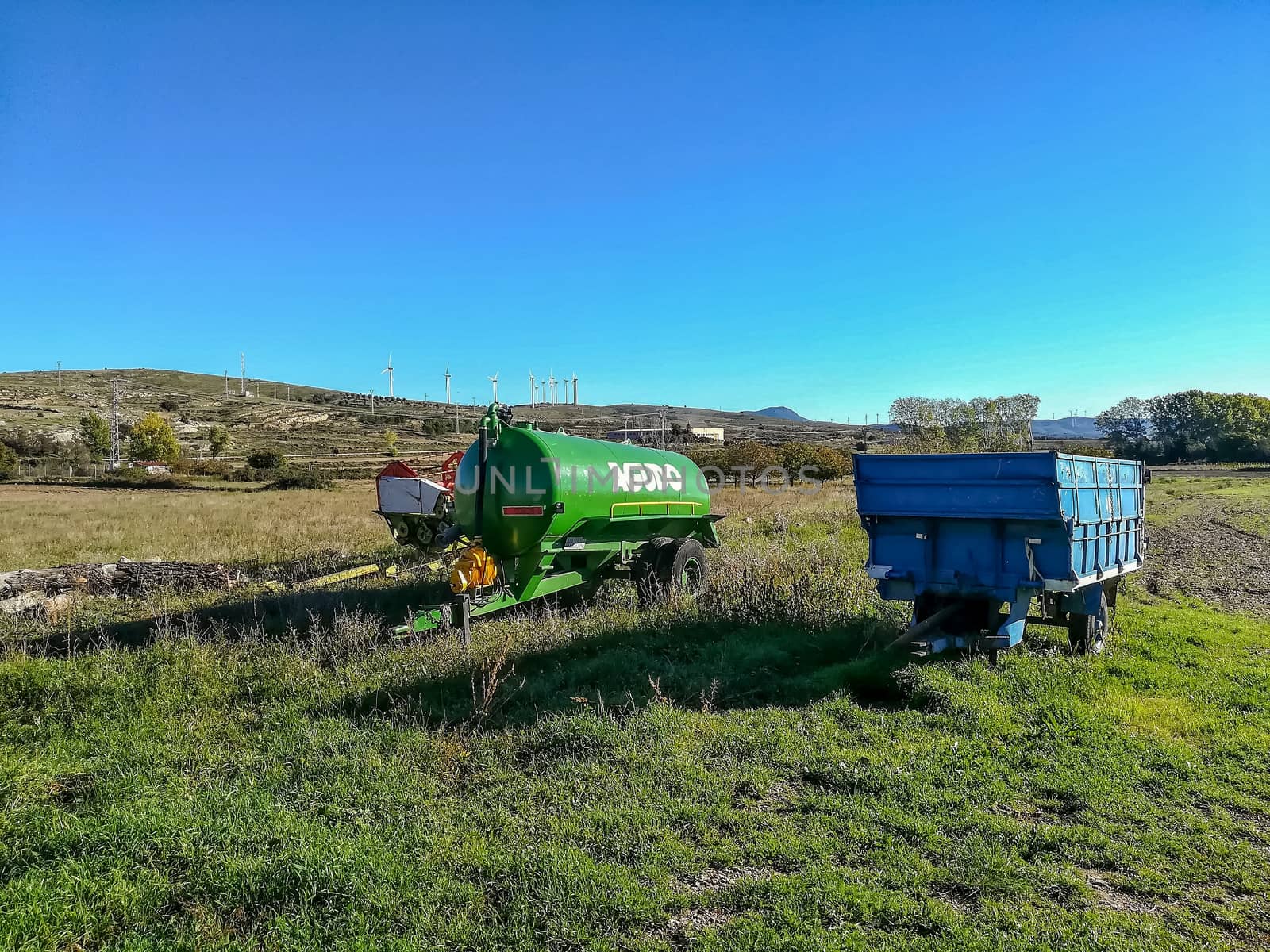 El Toro, Spain 10/24/2018: Tractor trailers in the field with mountains in the background