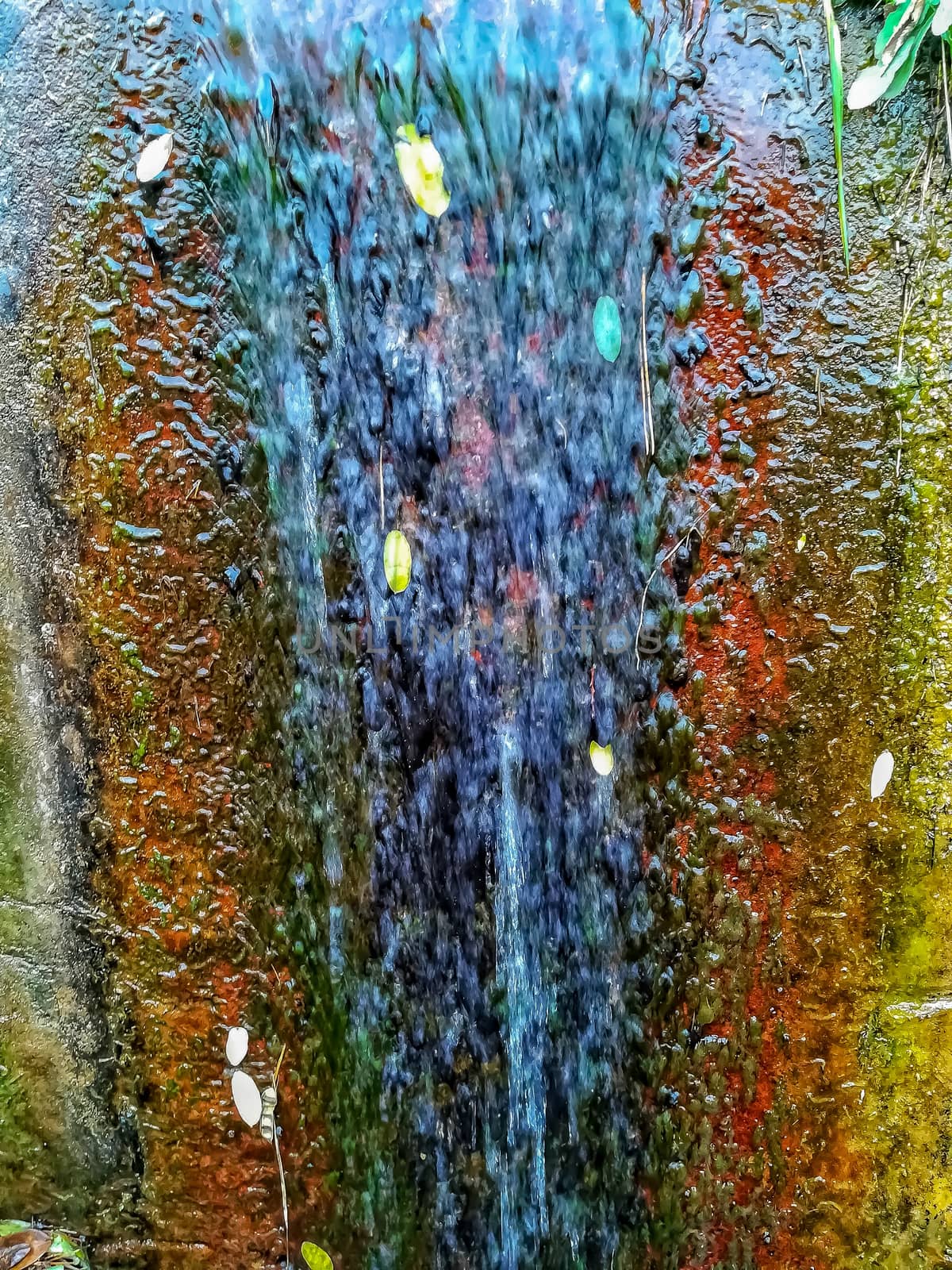 Colorful rust background with crystal clear water flowing