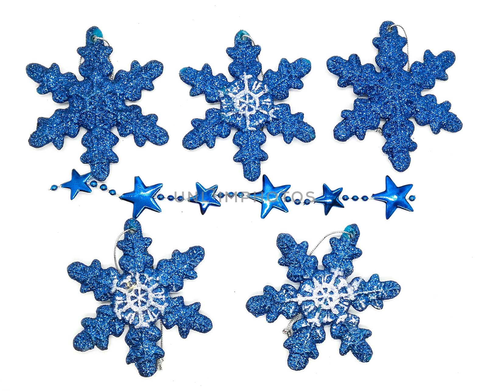 Blue christmas decorations in composition on white background
