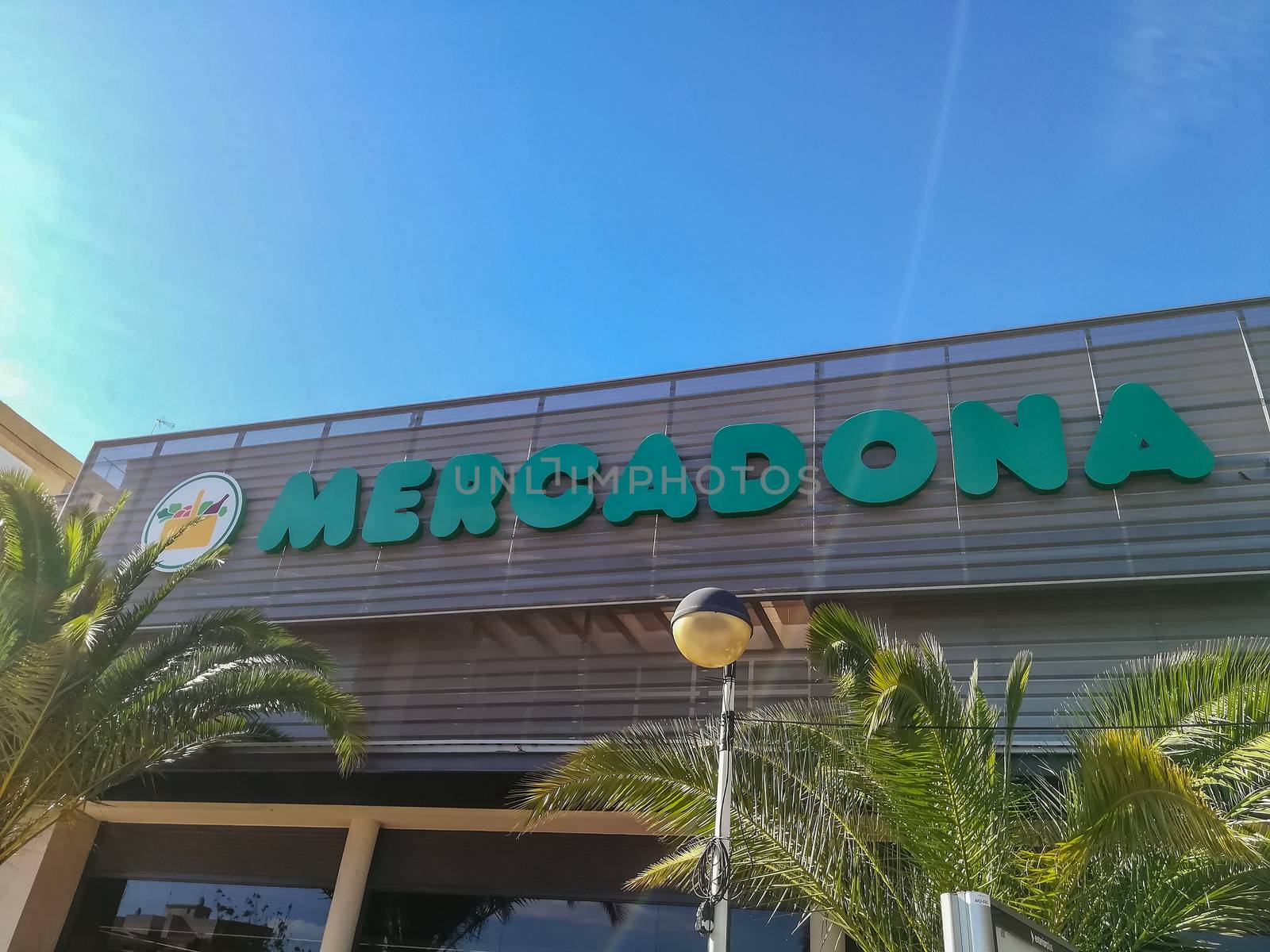 Puzol, Spain 11/07/18: Mercadona poster with blue sky