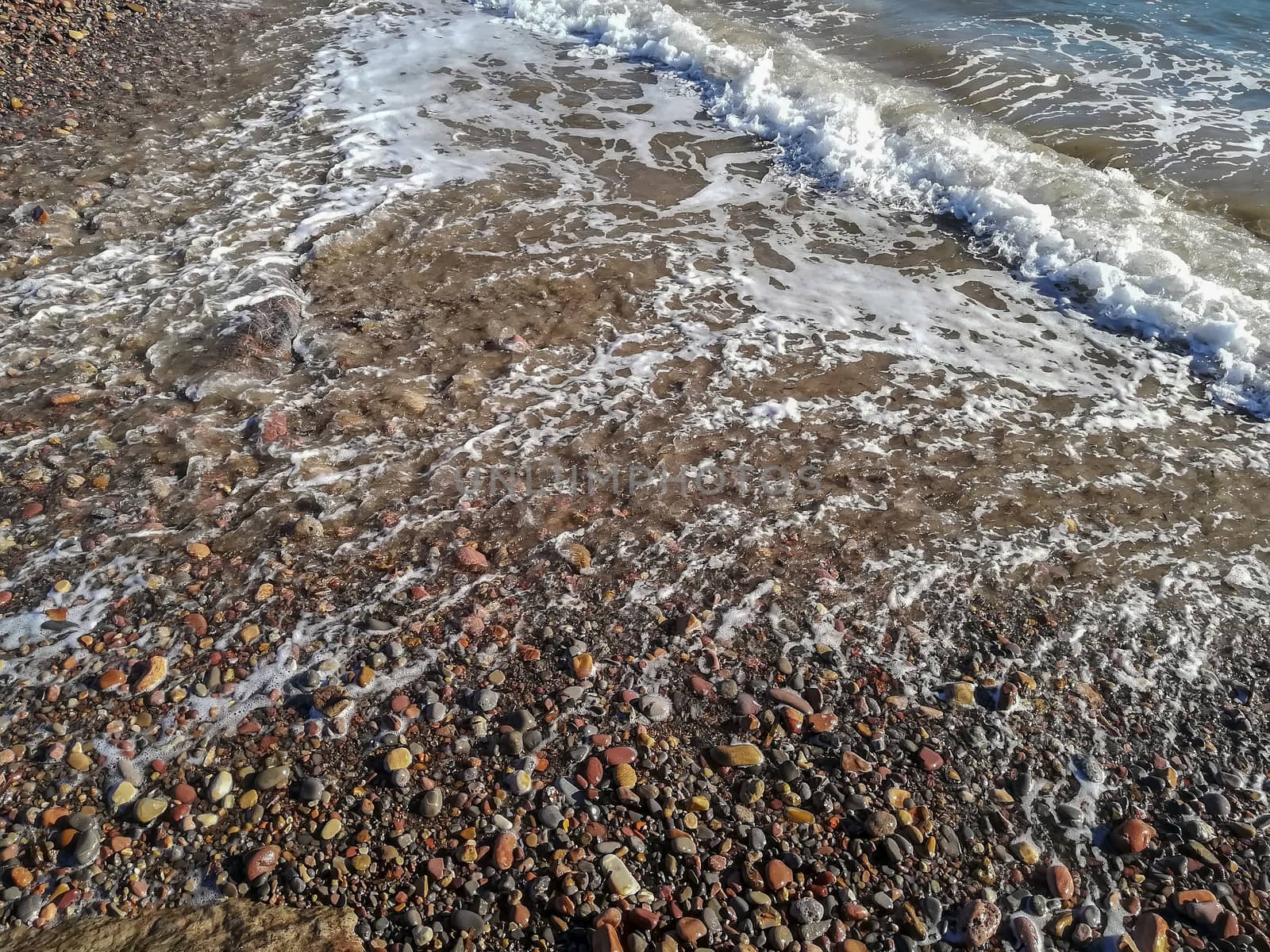 Small stone beach bathed by the waters of the Mediterranean Sea
