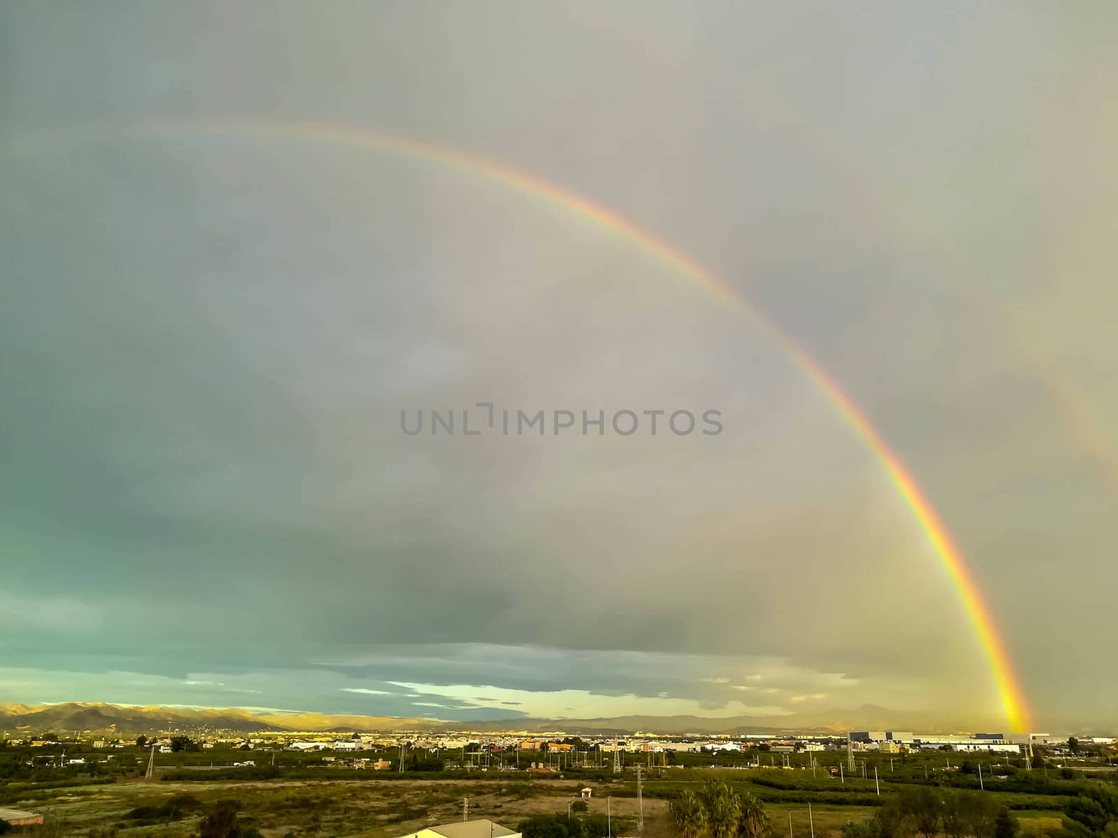 View of two rainbow media on a cloudy day