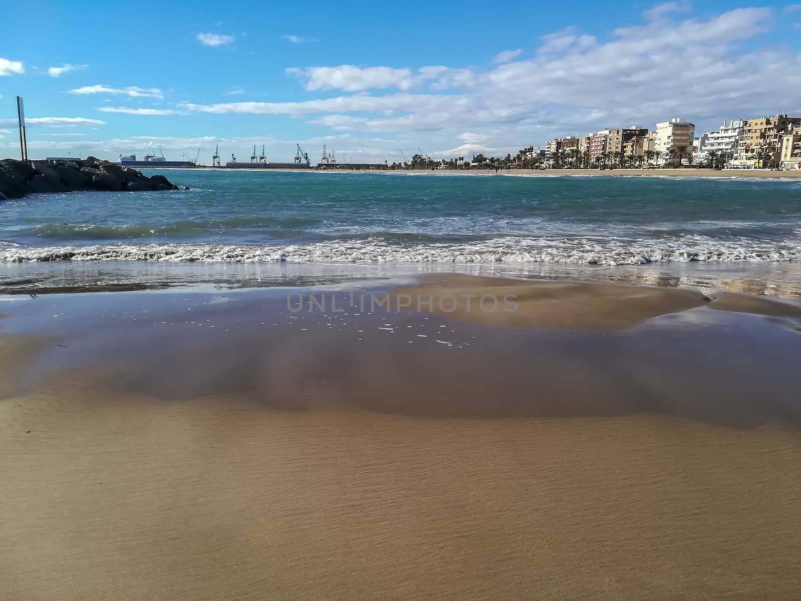 Beach of fine brown sand bathed by the waters of the Mediterranean Sea