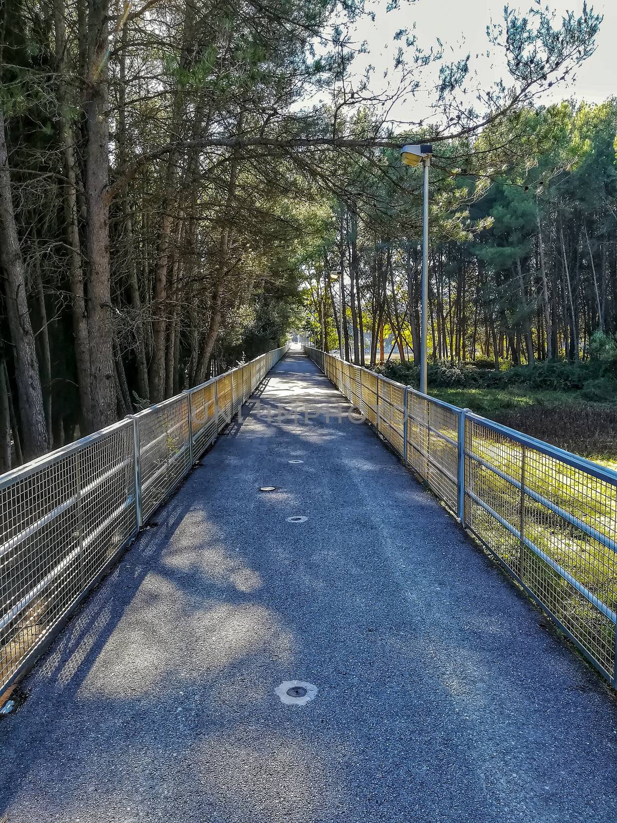 Gateway to the Regajo reservoir with metal railings