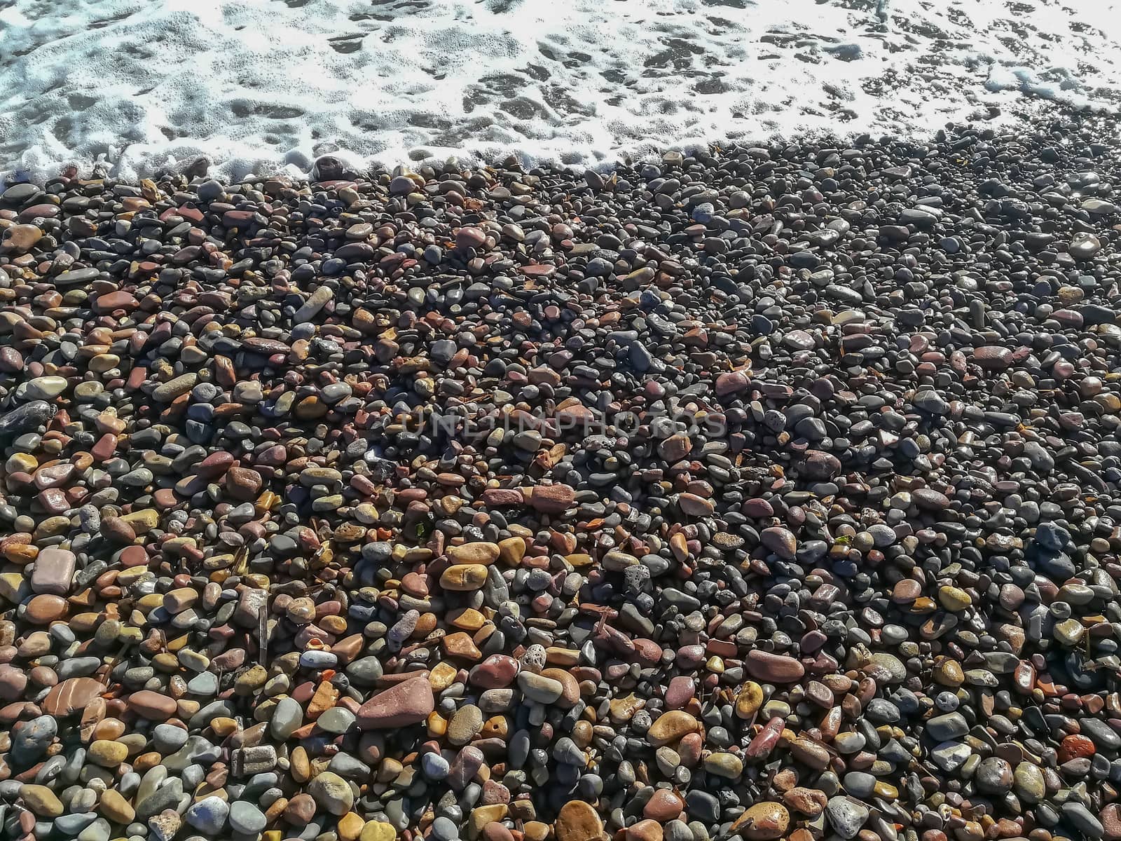 Small stone beach bathed by the waters of the Mediterranean Sea