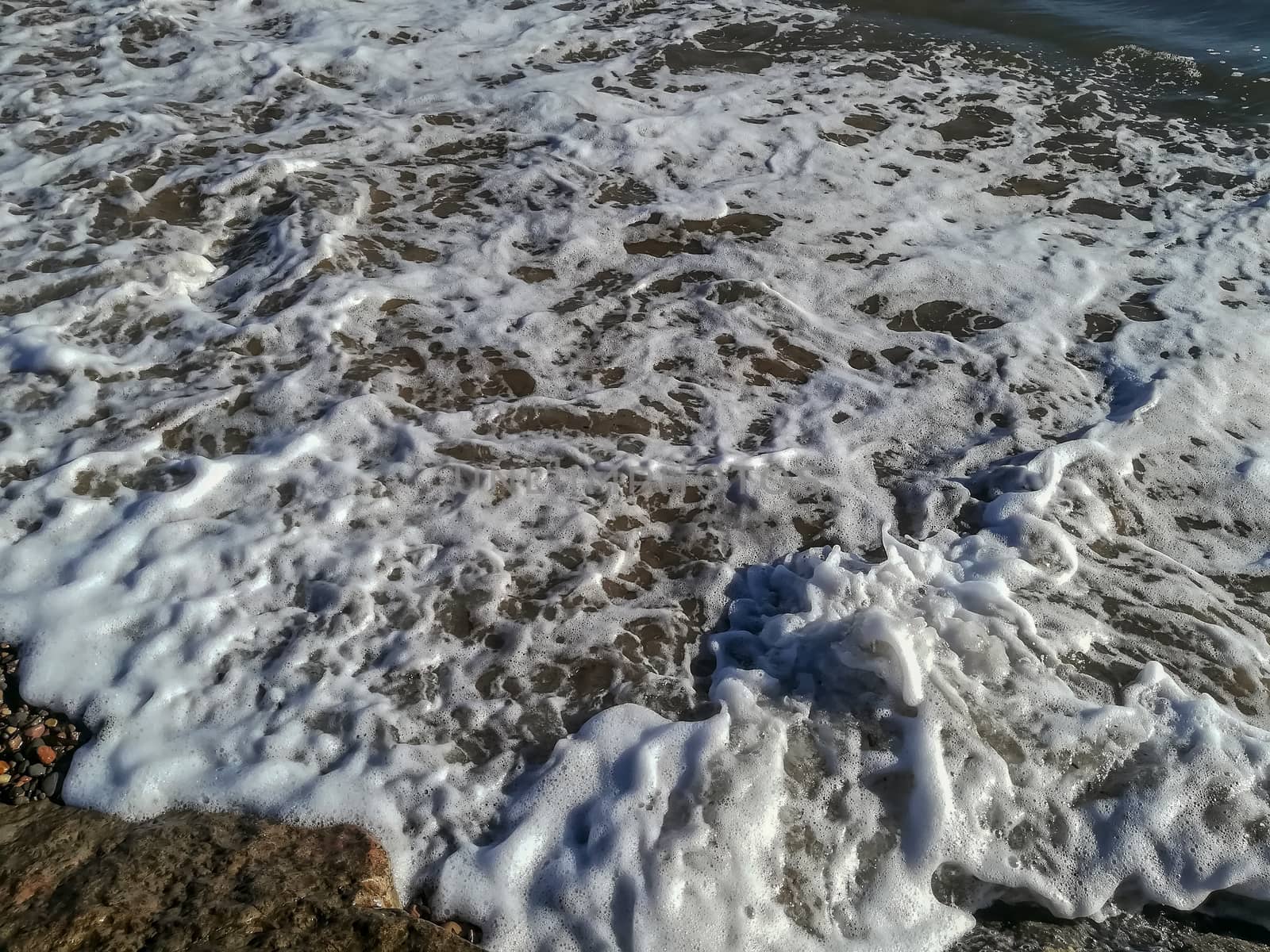 Small stone beach bathed by the waters of the Mediterranean Sea