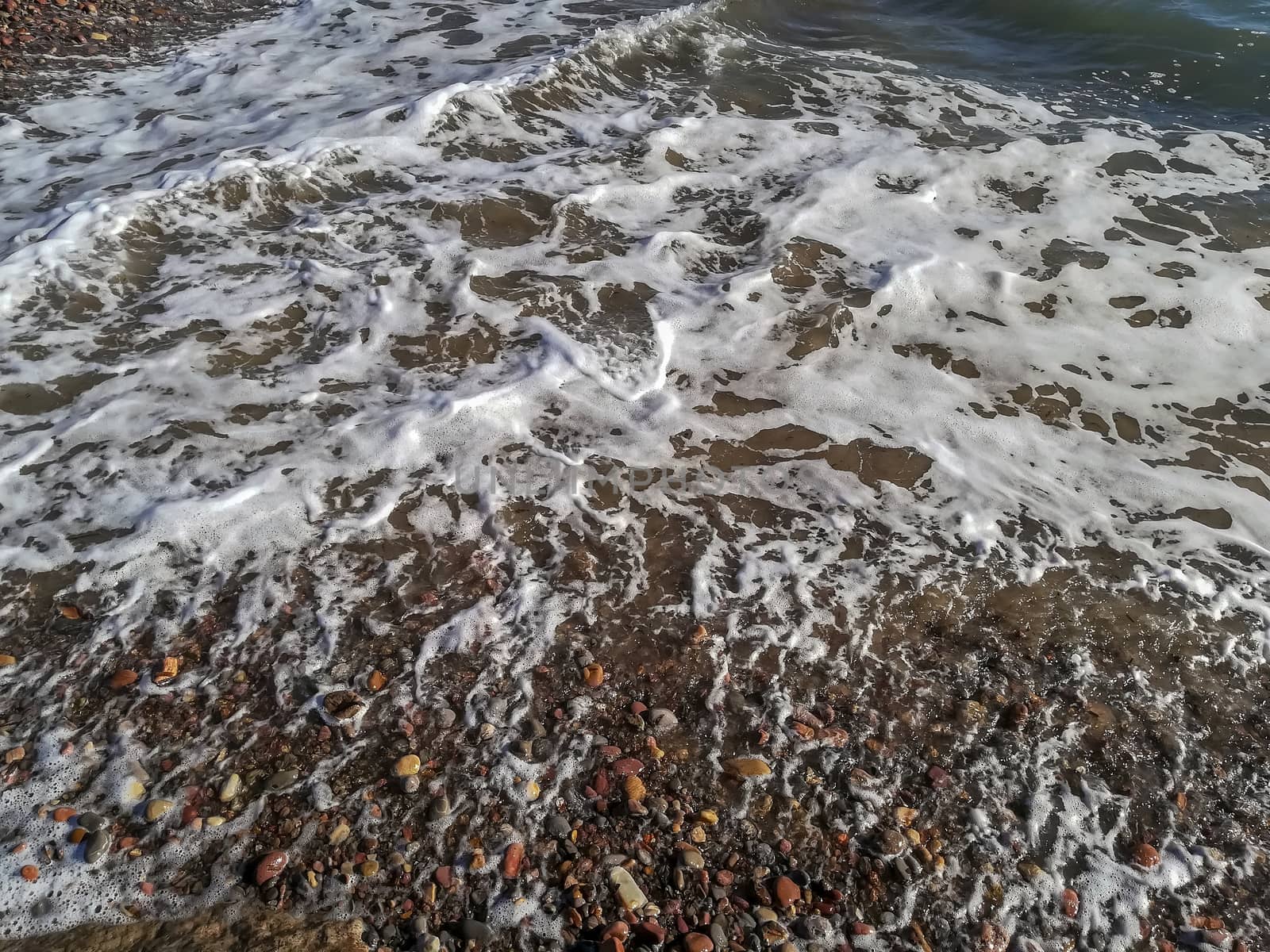 Small stone beach bathed by the waters of the Mediterranean Sea