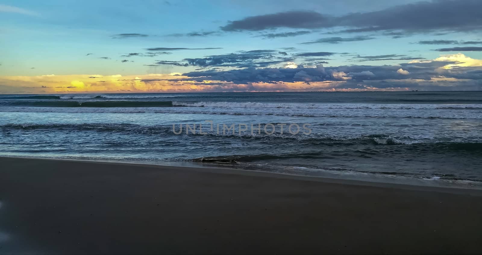 Beach of fine brown sand bathed by the waters of the Mediterranean Sea