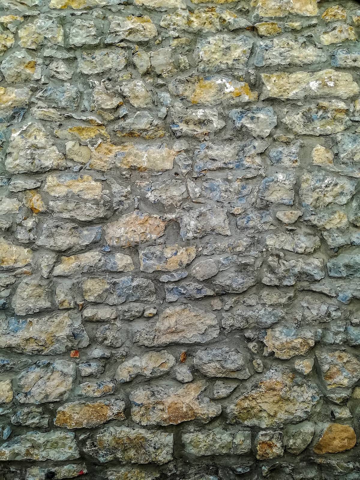 Facade of natural stone and gray cement